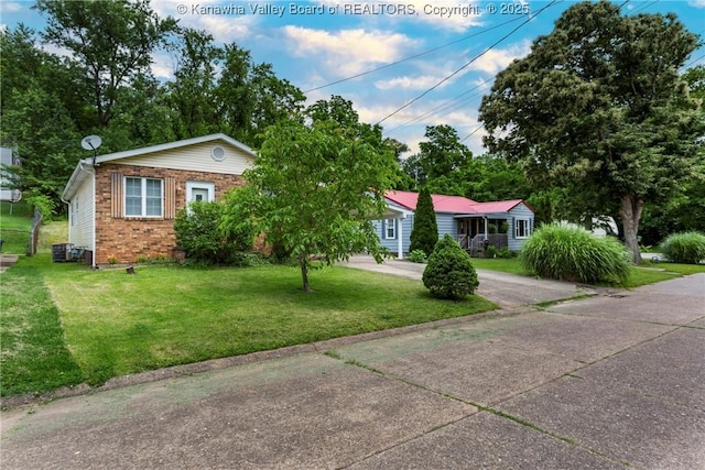 3983 39th St E, Nitro, WV 25143 - view of front of home featuring brick siding and a front lawn