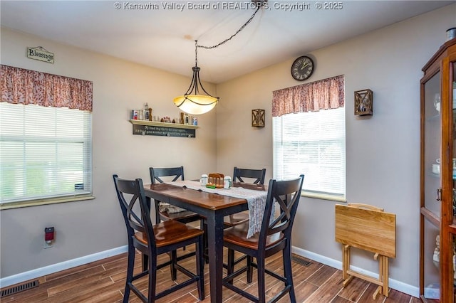 3983 39th St E, Nitro, WV 25143 - dining space featuring dark wood-style flooring and healthy amount of natural light