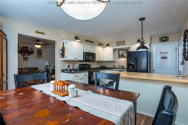 3983 39th St E, Nitro, WV 25143 - dining room with dark wood-style floors and ceiling fan