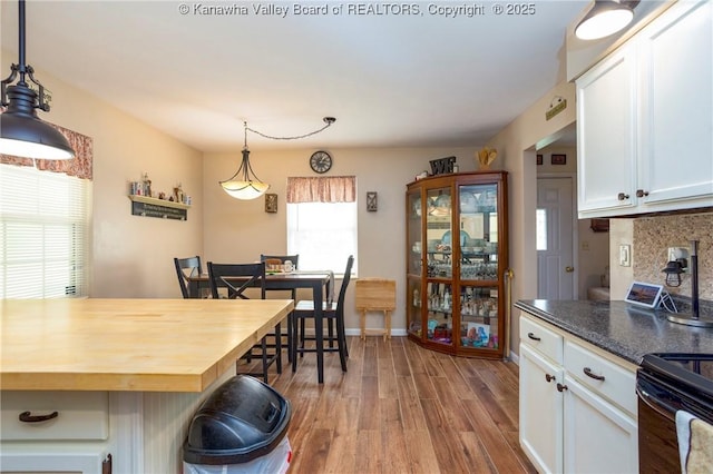 3983 39th St E, Nitro, WV 25143 - kitchen featuring wood finished floors, white cabinetry, and wooden counters