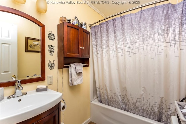 3983 39th St E, Nitro, WV 25143 - bathroom with vanity, shower / bath combo, and crown molding