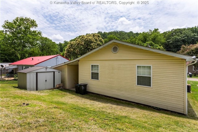 3983 39th St E, Nitro, WV 25143 - rear view of property with a storage unit and a yard