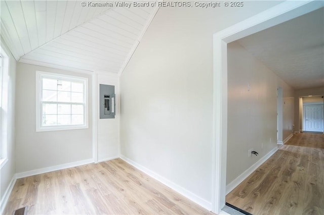 2023 Roxalana Rd, Dunbar, WV 25064 - spare room with electric panel, light wood-style floors, and vaulted ceiling
