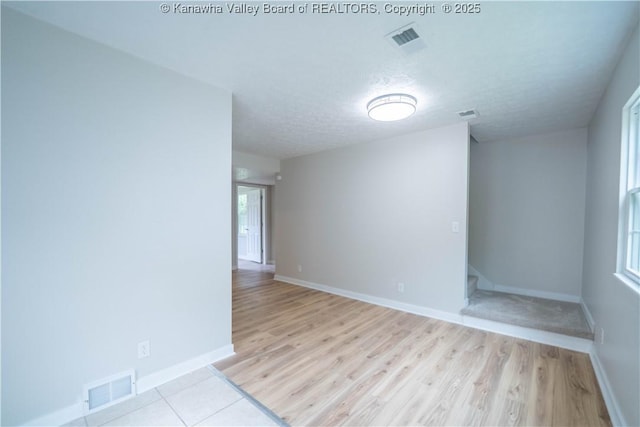 2023 Roxalana Rd, Dunbar, WV 25064 - unfurnished room featuring wood finished floors and a textured ceiling