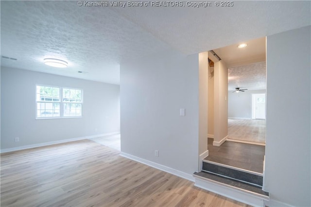 2023 Roxalana Rd, Dunbar, WV 25064 - unfurnished room featuring a textured ceiling, wood finished floors, and recessed lighting