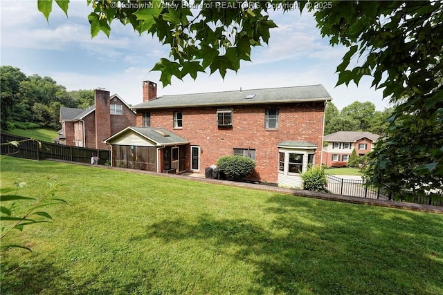 32 Carriage Rd, Charleston, WV 25314 - rear view of property with a sunroom, brick siding, and a chimney