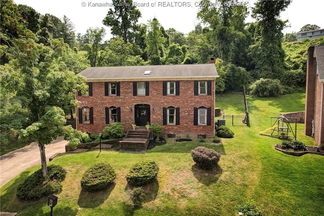 32 Carriage Rd, Charleston, WV 25314 - colonial inspired home with a chimney and brick siding