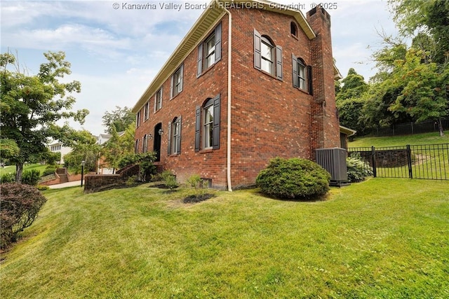 32 Carriage Rd, Charleston, WV 25314 - view of property exterior with brick siding and a chimney