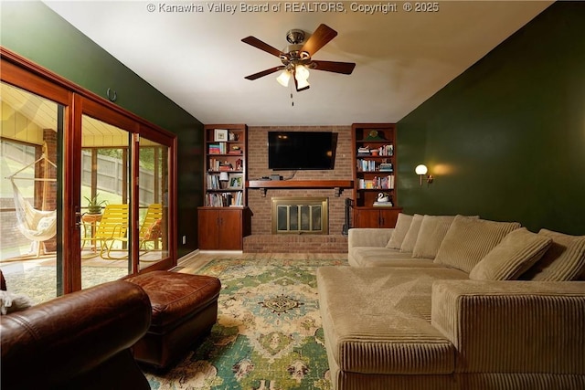 32 Carriage Rd, Charleston, WV 25314 - living area featuring a ceiling fan, a brick fireplace, and built in shelves