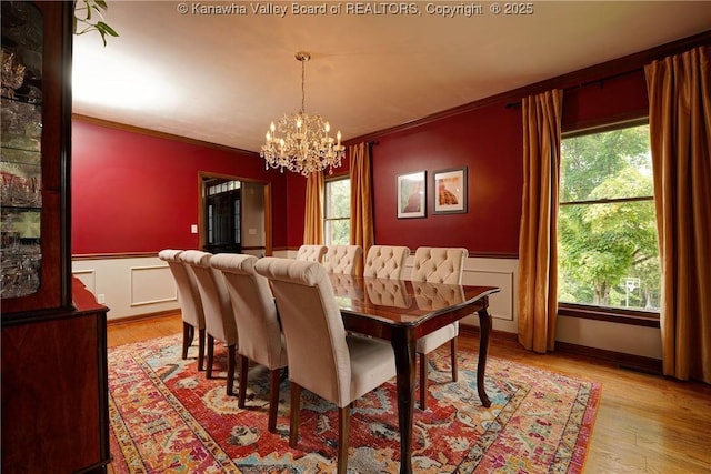 32 Carriage Rd, Charleston, WV 25314 - dining room with ornamental molding, a chandelier, a wainscoted wall, plenty of natural light, and light wood-style floors