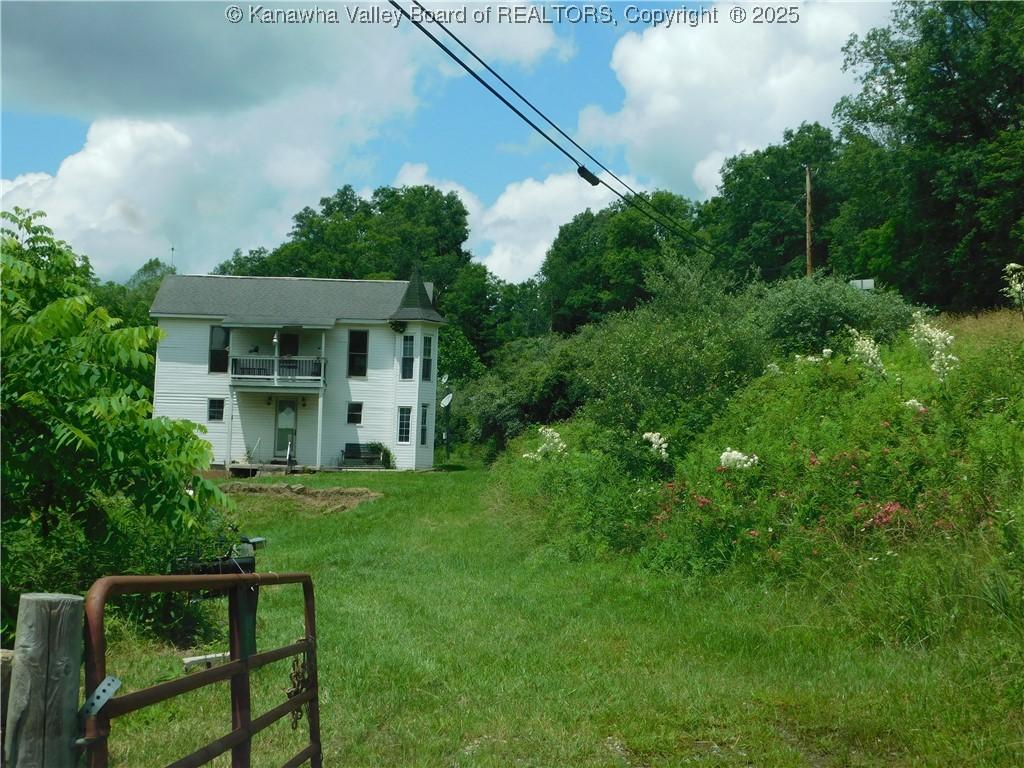 12555 Mclane Pike, Liberty, WV 25124 - view of green lawn with a balcony