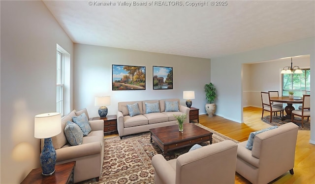 81 Hamill Rd, Huntington, WV 25701 - living area featuring light wood-style flooring and a chandelier