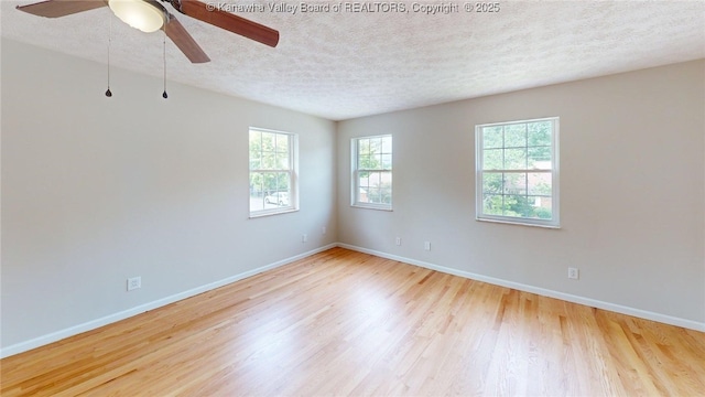 81 Hamill Rd, Huntington, WV 25701 - empty room featuring a textured ceiling, wood finished floors, and a ceiling fan