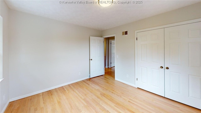 81 Hamill Rd, Huntington, WV 25701 - unfurnished bedroom featuring light wood-type flooring and a closet