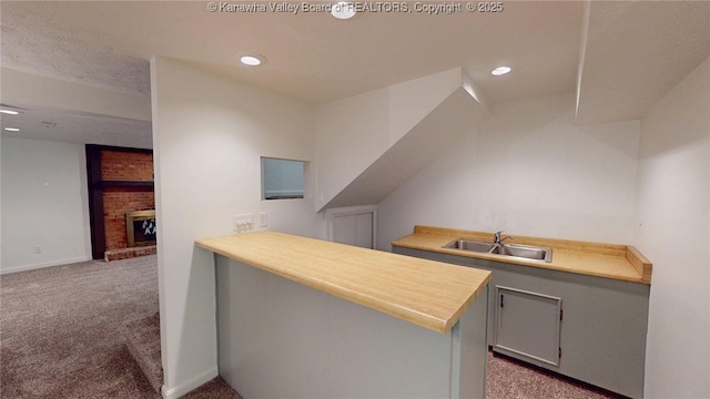 81 Hamill Rd, Huntington, WV 25701 - bar featuring carpet flooring, a brick fireplace, and recessed lighting
