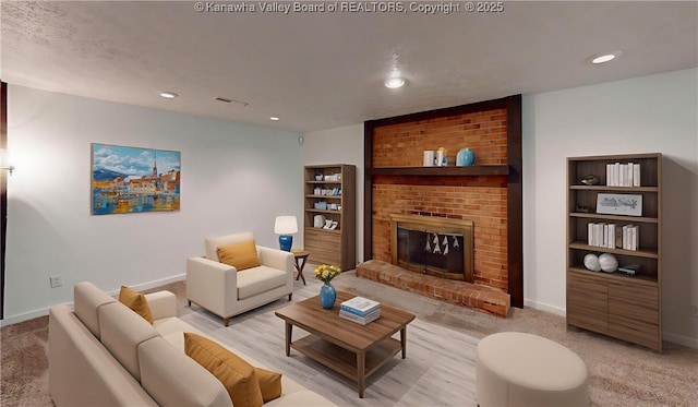 81 Hamill Rd, Huntington, WV 25701 - living room with a fireplace, recessed lighting, light colored carpet, and built in features