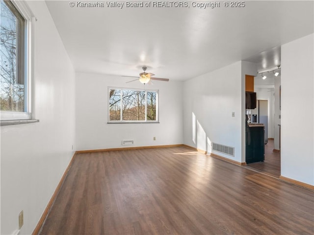 1216 Oakmont Rd, Charleston, WV 25314 - empty room with wood finished floors, healthy amount of natural light, a ceiling fan, and rail lighting