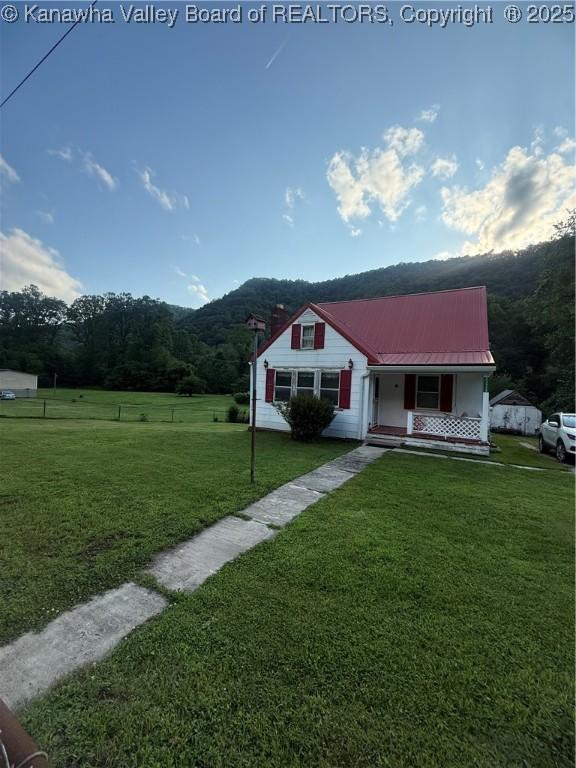 23908 Coal River Rd, Wv, WV 25148 - view of front facade featuring covered porch and a metal roof