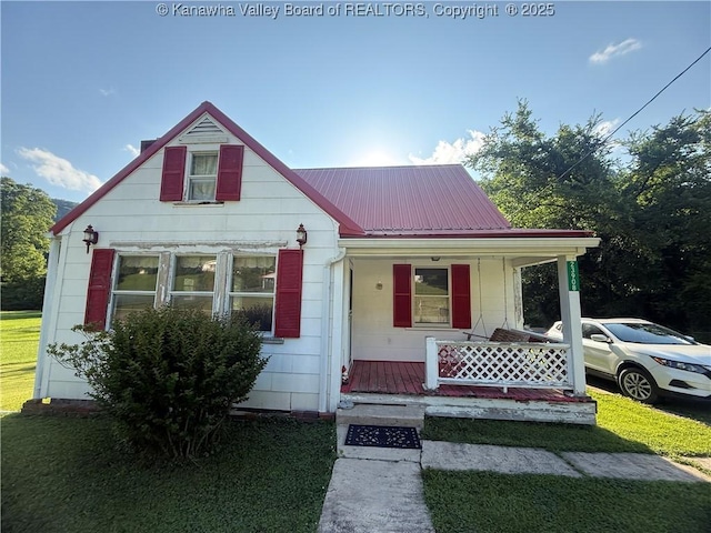23908 Coal River Rd, Wv, WV 25148 - bungalow-style home featuring covered porch, a metal roof, and a front lawn