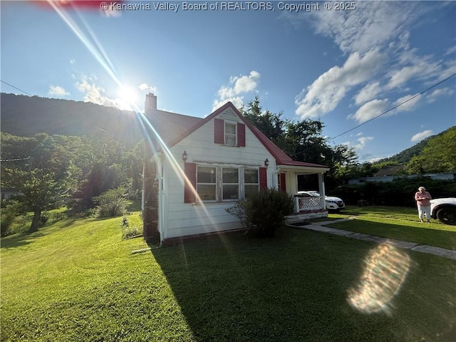 23908 Coal River Rd, Wv, WV 25148 - bungalow-style house with a front lawn and a chimney