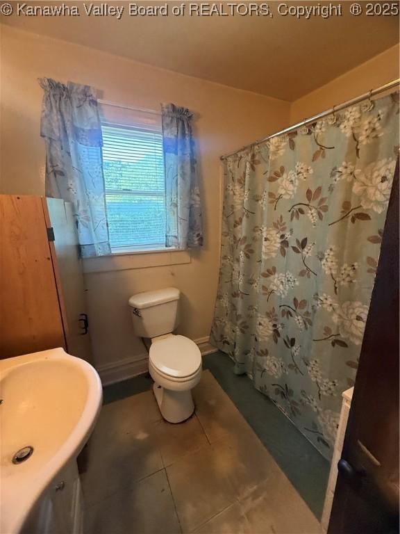 23908 Coal River Rd, Wv, WV 25148 - bathroom with vanity, tile patterned floors, and a shower with shower curtain