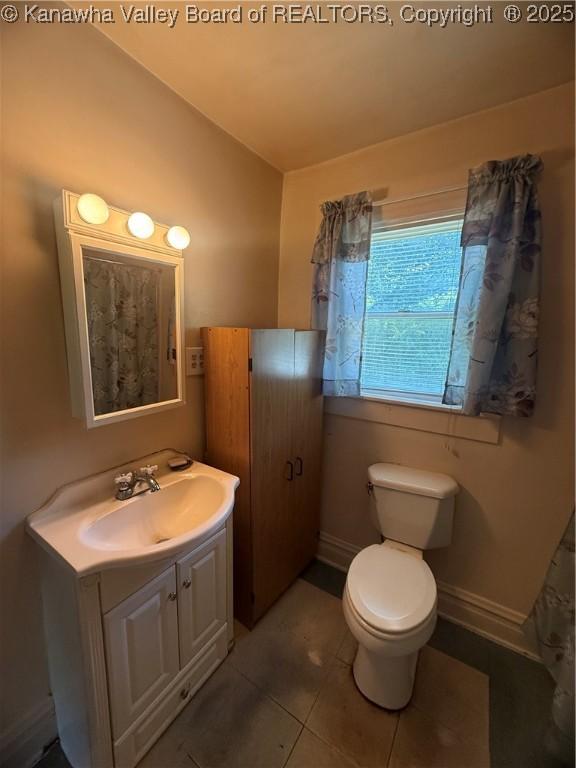 23908 Coal River Rd, Wv, WV 25148 - bathroom featuring vaulted ceiling, vanity, and tile patterned floors