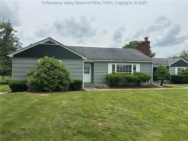 2515 Mount Vernon Ave, Point Pleasant, WV 25550 - ranch-style house featuring a front yard, a chimney, board and batten siding, and roof with shingles