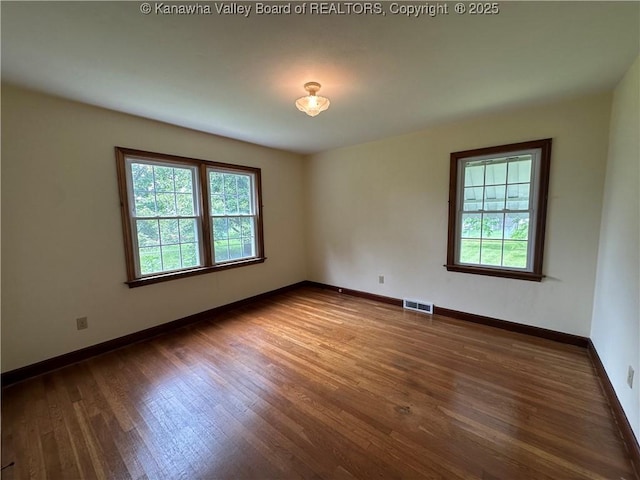 2515 Mount Vernon Ave, Point Pleasant, WV 25550 - empty room featuring healthy amount of natural light and wood finished floors