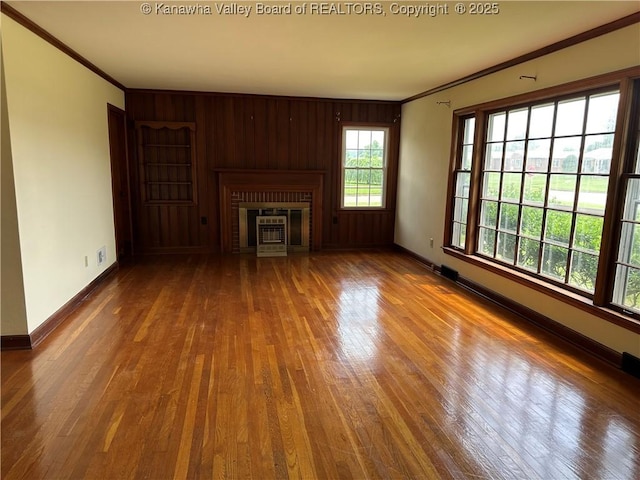 2515 Mount Vernon Ave, Point Pleasant, WV 25550 - unfurnished living room with crown molding, wood finished floors, a fireplace, and wood walls