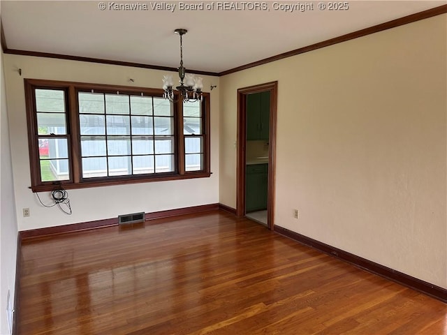 2515 Mount Vernon Ave, Point Pleasant, WV 25550 - unfurnished room with a chandelier, wood finished floors, and ornamental molding