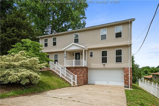 207 Branchfield Dr, Charleston, WV 25314 - colonial home with an attached garage, driveway, brick siding, and covered porch