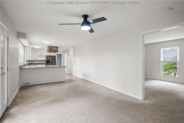 207 Branchfield Dr, Charleston, WV 25314 - unfurnished living room with light carpet and ceiling fan