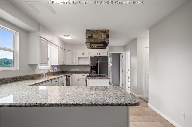 207 Branchfield Dr, Charleston, WV 25314 - kitchen with fridge with ice dispenser, dark stone counters, a peninsula, white cabinetry, and dishwasher