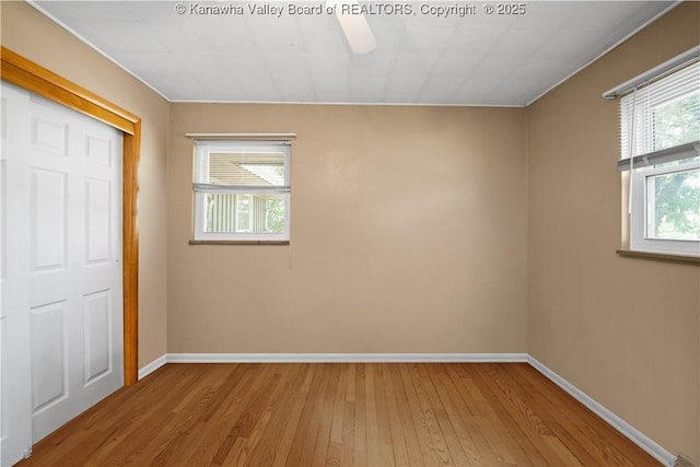 1204 Crown Dr, South Charleston, WV 25309 - unfurnished bedroom with wood finished floors, a closet, and ceiling fan