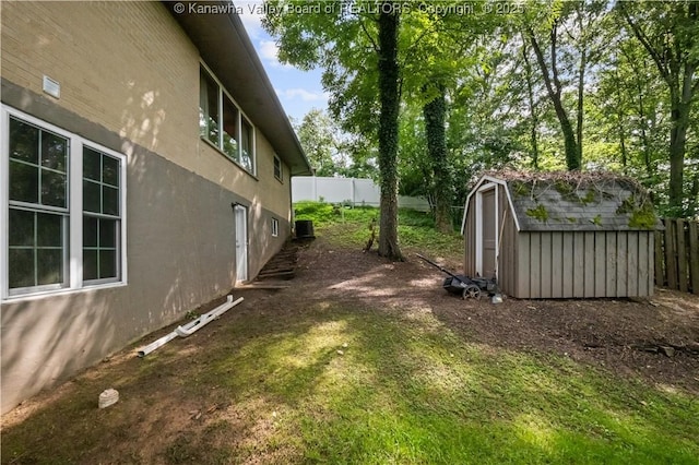 1204 Crown Dr, South Charleston, WV 25309 - fenced backyard featuring a storage unit