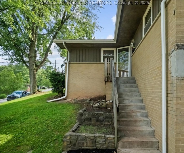 1204 Crown Dr, South Charleston, WV 25309 - view of exterior entry with a yard and brick siding