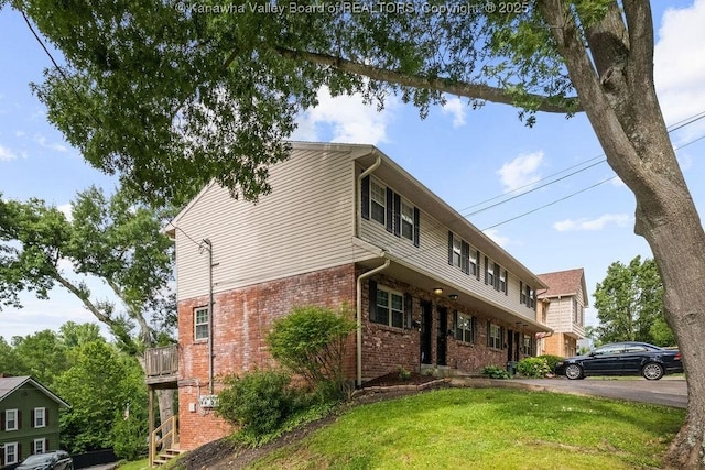 1013 Walnut Rd Unit 4, Charleston, WV 25314 - view of front of home featuring brick siding and a front yard