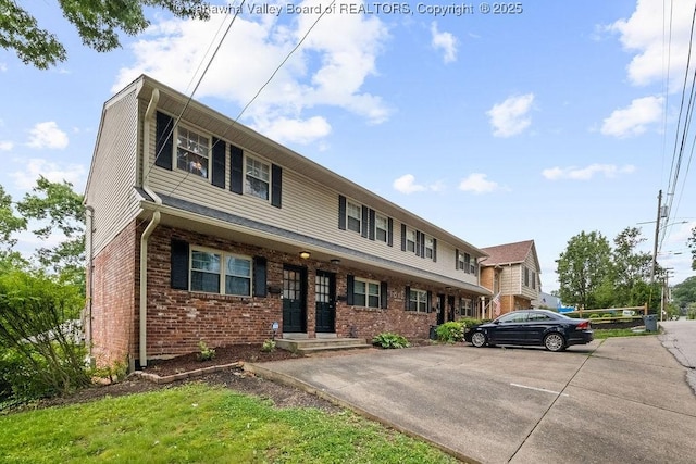 1013 Walnut Rd Unit 4, Charleston, WV 25314 - townhome / multi-family property with brick siding and uncovered parking