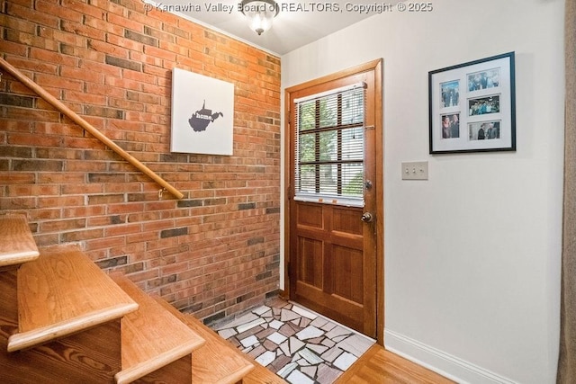 1013 Walnut Rd Unit 4, Charleston, WV 25314 - doorway to outside with brick wall and light wood-style floors