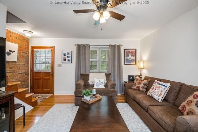 1013 Walnut Rd Unit 4, Charleston, WV 25314 - living room with plenty of natural light, wood finished floors, a ceiling fan, and stairs