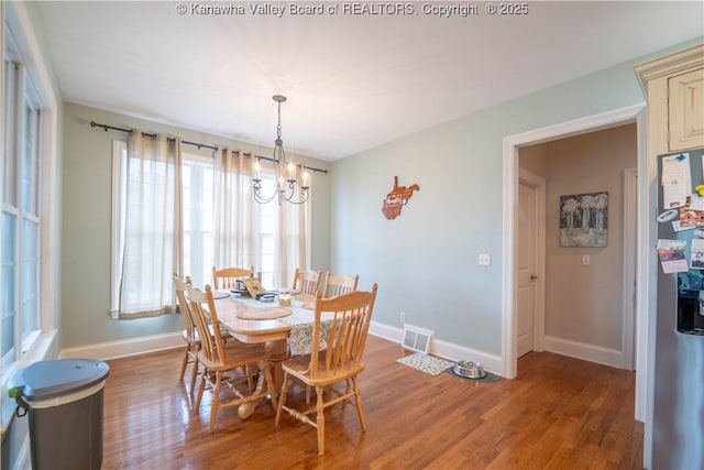 365 Tyler Way, Scott Depot, WV 25560 - dining space featuring a chandelier and light wood finished floors