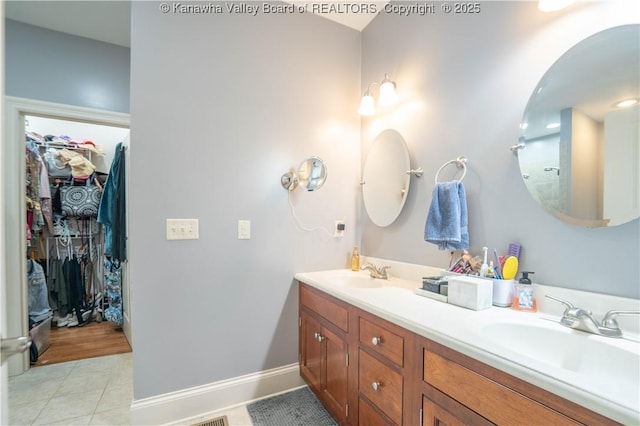 365 Tyler Way, Scott Depot, WV 25560 - full bathroom featuring double vanity, tile patterned flooring, and a walk in closet