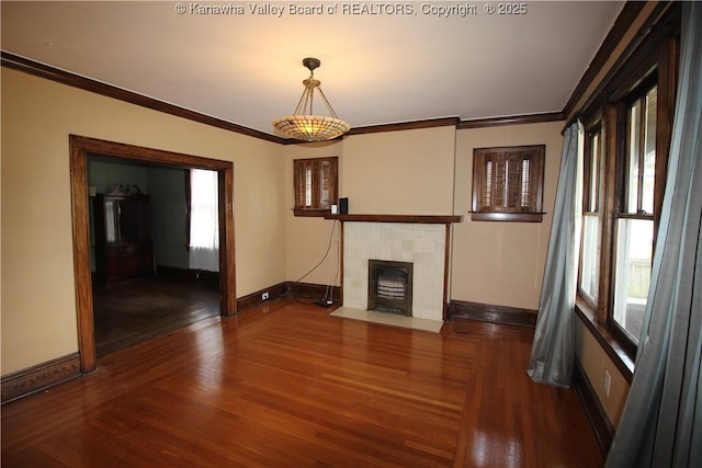 624 Randolph St, Charleston, WV 25302 - unfurnished living room featuring wood finished floors, a fireplace, and crown molding