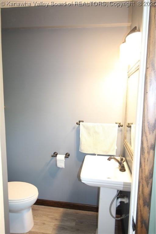 624 Randolph St, Charleston, WV 25302 - bathroom with toilet and wood finished floors