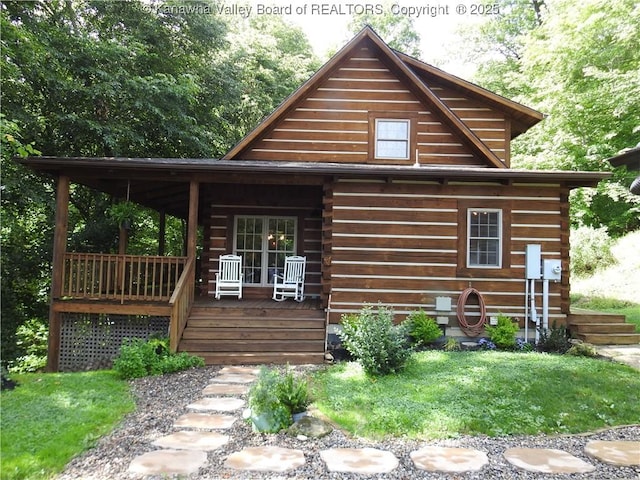 5609 Hurricane Creek Rd, Hurricane, WV 25526 - log-style house with covered porch and log siding