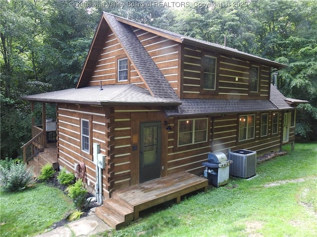 5609 Hurricane Creek Rd, Hurricane, WV 25526 - log-style house with roof with shingles, a front lawn, and log exterior