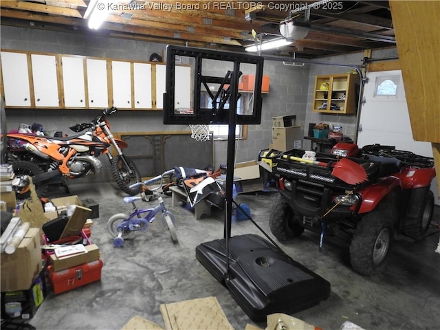 5609 Hurricane Creek Rd, Hurricane, WV 25526 - garage with a garage door opener and concrete block wall