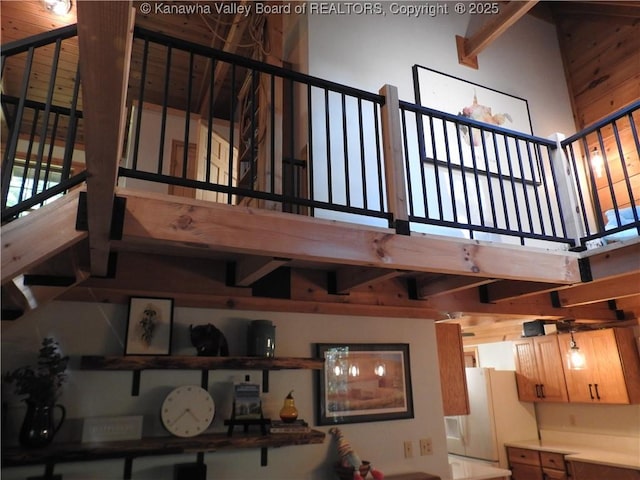 5609 Hurricane Creek Rd, Hurricane, WV 25526 - staircase with beam ceiling, a towering ceiling, and wooden walls