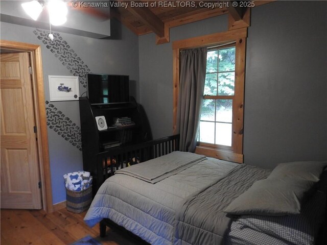 5609 Hurricane Creek Rd, Hurricane, WV 25526 - bedroom with wood finished floors and a wooden ceiling with exposed beams
