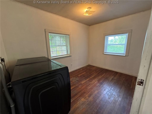 292 Maysel Laurel Ridge Rd, Wv, WV 25133 - unfurnished bedroom featuring multiple windows, dark wood-style floors, and washer / clothes dryer
